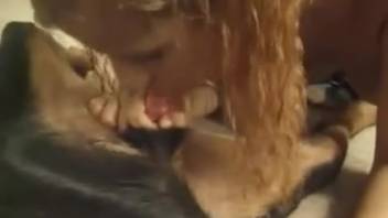 Bushy pussy chick gagging on a canine's cock
